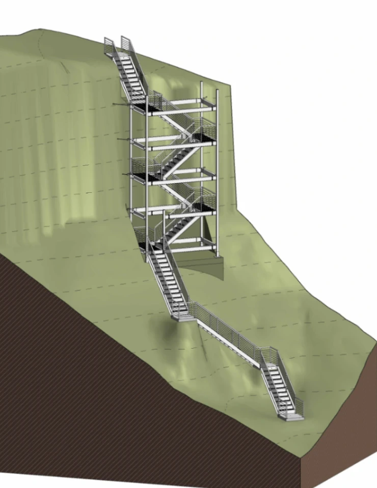 Aluminium stair tower with multiple landings and a stair run descending a sloped bluff.